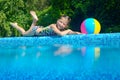 Little girl relaxing near pool, underwater and above view Royalty Free Stock Photo