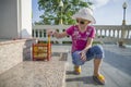 A little girl releasing birds from the cage