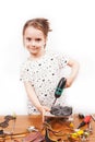 Little girl repair a computer component