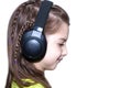 Portrait of a girl of seven years in headphones.