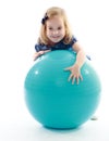 Little girl rides a big sports ball Royalty Free Stock Photo