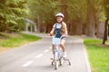 Little Girl Riding Bicycle Wearing Protective Helmet Having Fun Outdoors