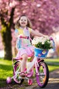 Little girl riding a bike. Child on bicycle. Royalty Free Stock Photo