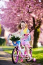 Little girl riding a bike. Child on bicycle. Royalty Free Stock Photo