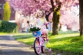 Little girl riding a bike. Child on bicycle. Royalty Free Stock Photo