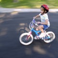 Little Girl Riding a Bike Speedy Fast