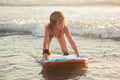 Little girl riding a boogie board Royalty Free Stock Photo