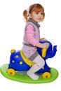 Little girl riding elephant toy Royalty Free Stock Photo