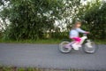Little girl riding her little bike at speed Royalty Free Stock Photo