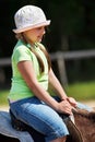 Little girl riding horse Royalty Free Stock Photo