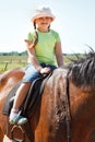 Little girl riding horse Royalty Free Stock Photo