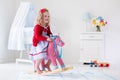 Little girl riding a toy horse Royalty Free Stock Photo