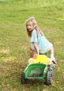 Little girl riding a tractor