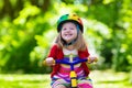 Little girl riding a tricycle