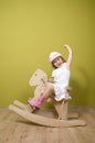 Little girl and rocking horse