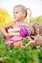 Little girl rocks to sleep the doll Royalty Free Stock Photo