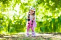 Little girl with roller skate shoes in a park Royalty Free Stock Photo