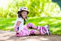 Little girl with roller skate shoes in a park Royalty Free Stock Photo