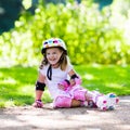 Little girl with roller skate shoes in a park Royalty Free Stock Photo