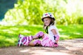 Little girl with roller skate shoes in a park Royalty Free Stock Photo