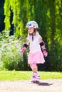 Little girl with roller skate shoes in a park Royalty Free Stock Photo