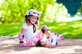 Little girl with roller skate shoes in a park Royalty Free Stock Photo