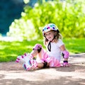 Little girl with roller skate shoes in a park Royalty Free Stock Photo