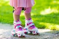 Little girl with roller skate shoes in a park Royalty Free Stock Photo