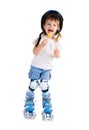 Little girl in roller skates with bon-bon