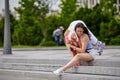 little girl on roller skates and her mother in park. Royalty Free Stock Photo