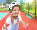 Little girl in roller skates on the playground Royalty Free Stock Photo