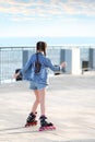 Little girl roller skating on street Royalty Free Stock Photo