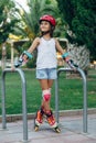 Little girl rollerskates Royalty Free Stock Photo