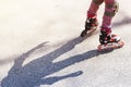 Active rest for children in the summer. Roller skating in the park Royalty Free Stock Photo