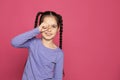 Little girl rubbing eye on color background, space for text.