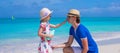 Little girl rubs sunscreen on nose of her dad Royalty Free Stock Photo