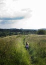 Little girl running along trail path Royalty Free Stock Photo