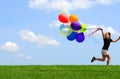 Little Girl Running with Balloons Royalty Free Stock Photo