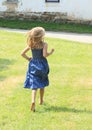Little girl running barefoot