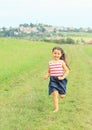 Little girl running barefoot