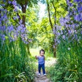 Little girl running in crested serpent field