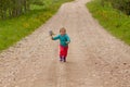 Little girl running down the road Royalty Free Stock Photo