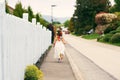 Little girl running down the street Royalty Free Stock Photo