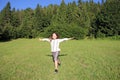 Little girl running on green grass field Royalty Free Stock Photo