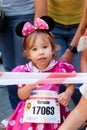 Little girl running on half-marathon competition Royalty Free Stock Photo