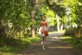 Little girl running skipping through the Park. Royalty Free Stock Photo