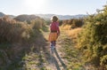 Little girl running through the Spanish landscape