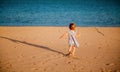 Girl running to the sea