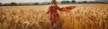 Little girl running through the wheat field Royalty Free Stock Photo