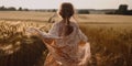 Little girl running through the wheat field Royalty Free Stock Photo